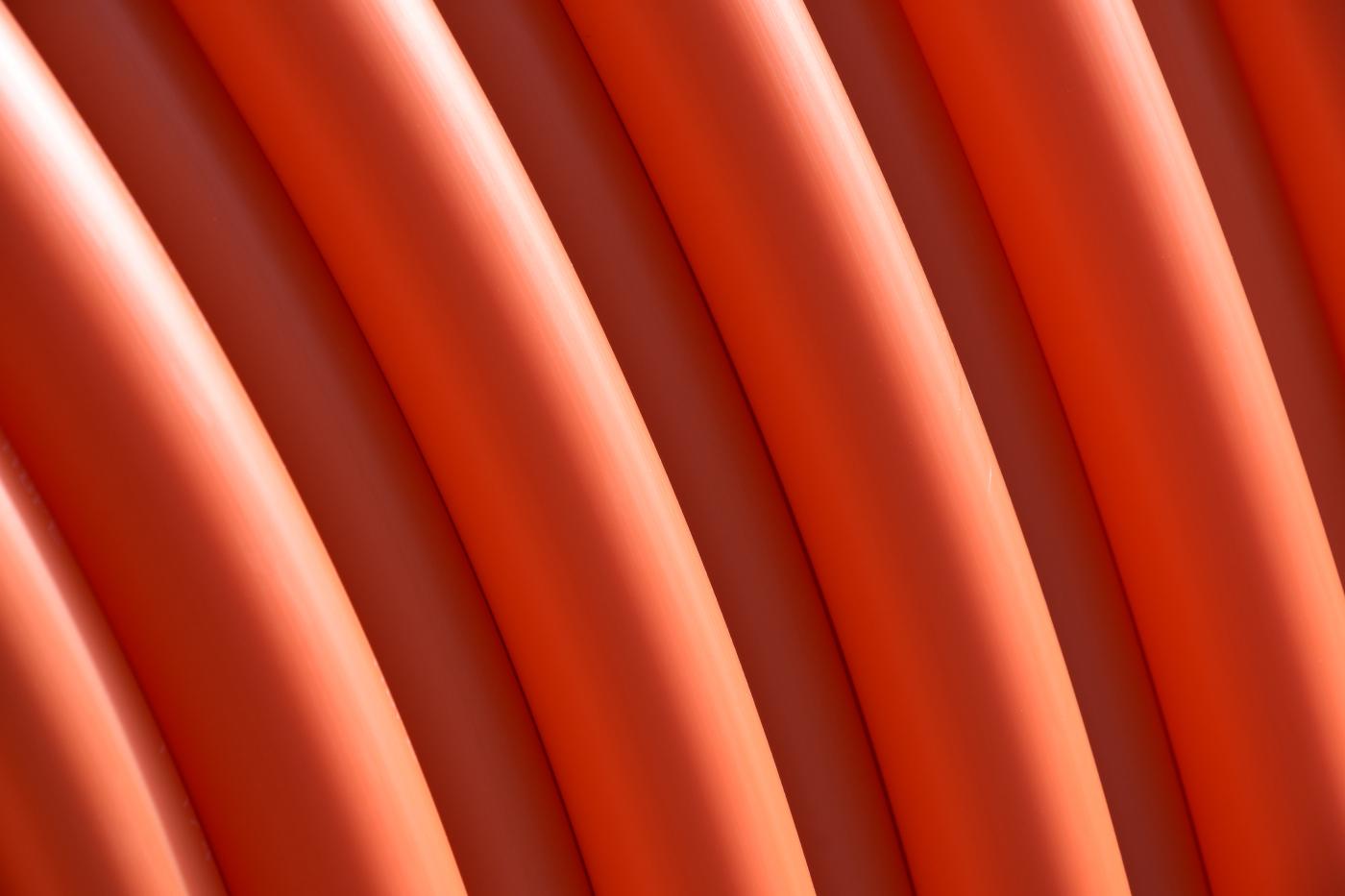 close-up image of coiled orange conduit