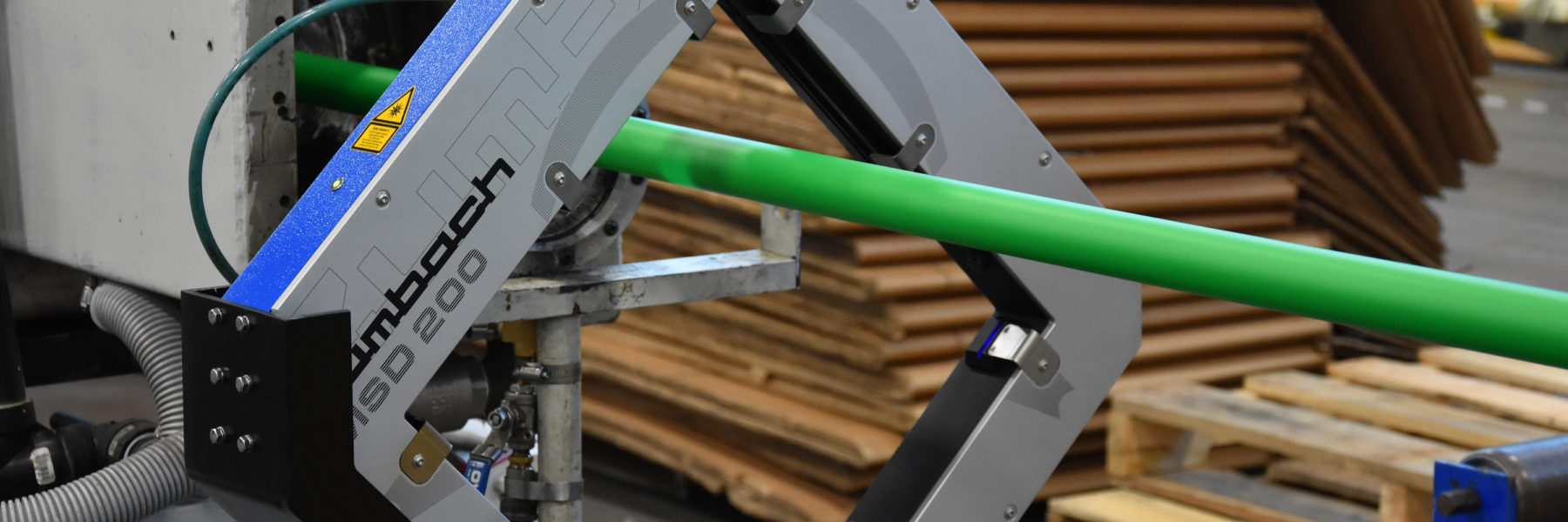 Green conduit running on extrusion line through Zumbach measurement device.